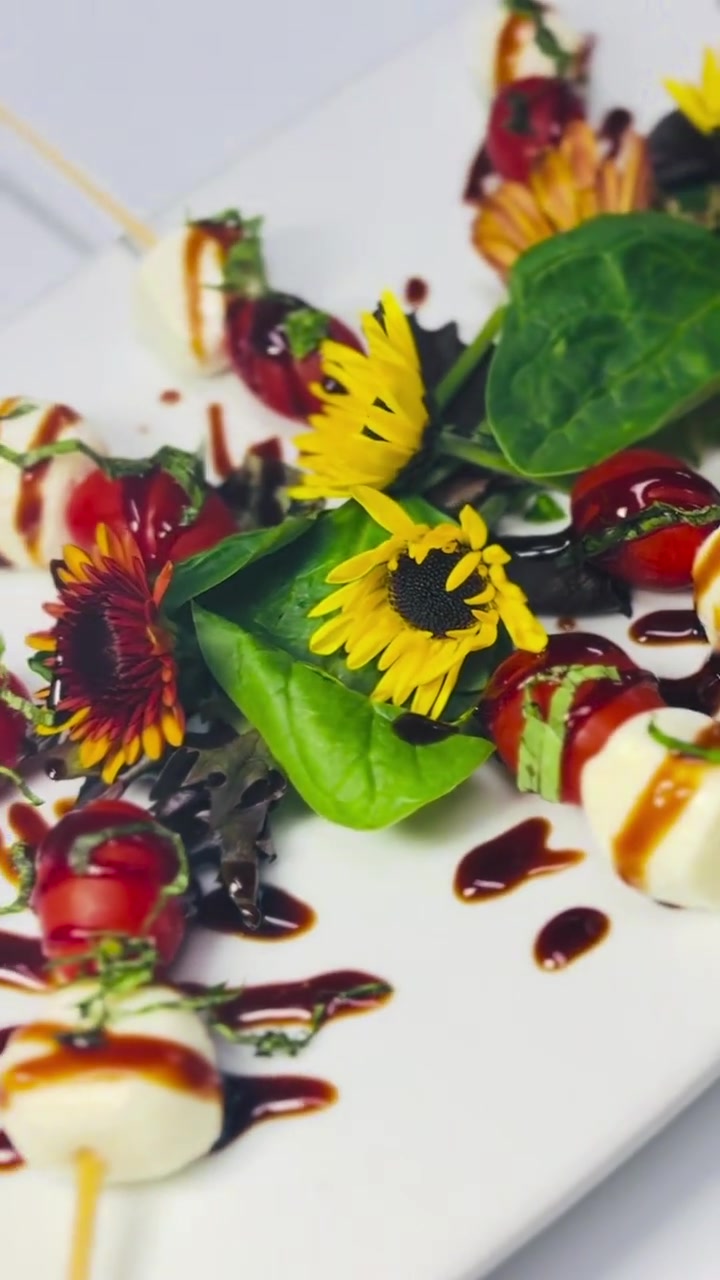 Caprese skewers with mozzarella, tomatoes, basil, and colorful presentation