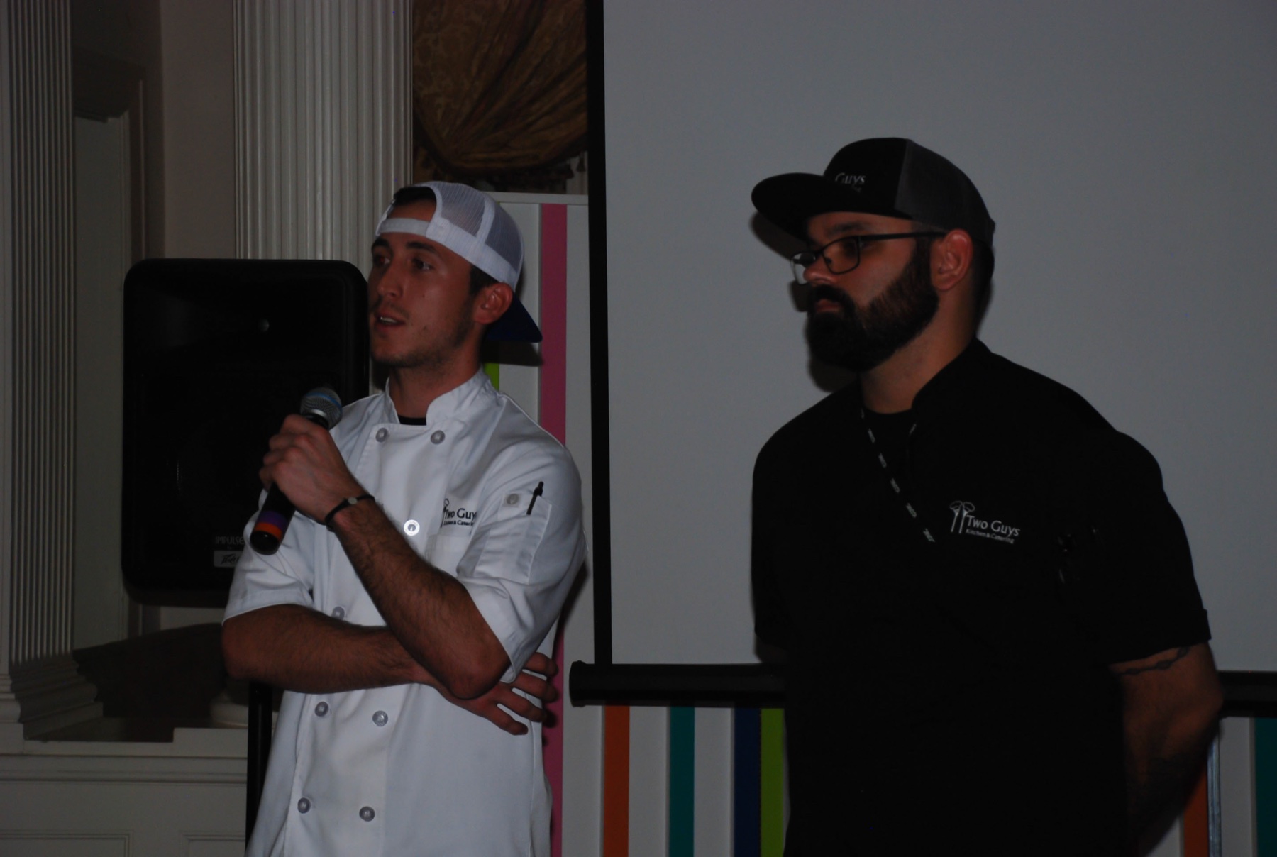 Larry and Kyle speaking at a PIKE alumni event catered by Two Guys at Florida Southern